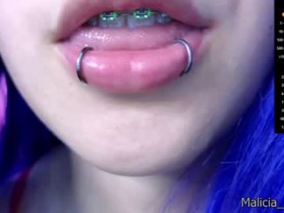 malicia_witch_ with a hairy pussy teasing it on a sex cam